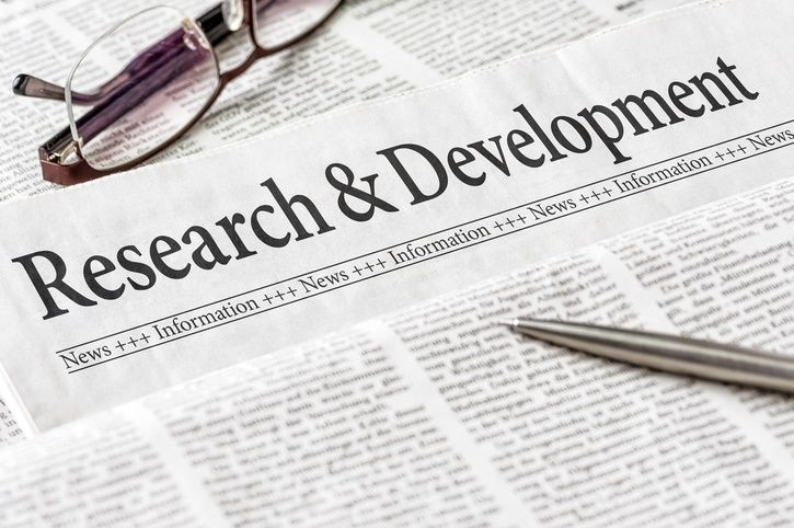 Newspaper with Research & development Headline
